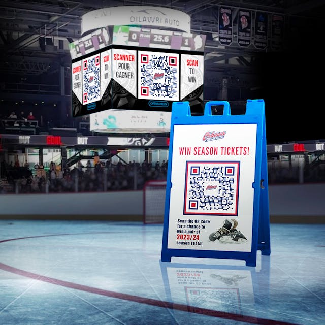 A QR code displayed on a sandwich board and time clock in a sports arena